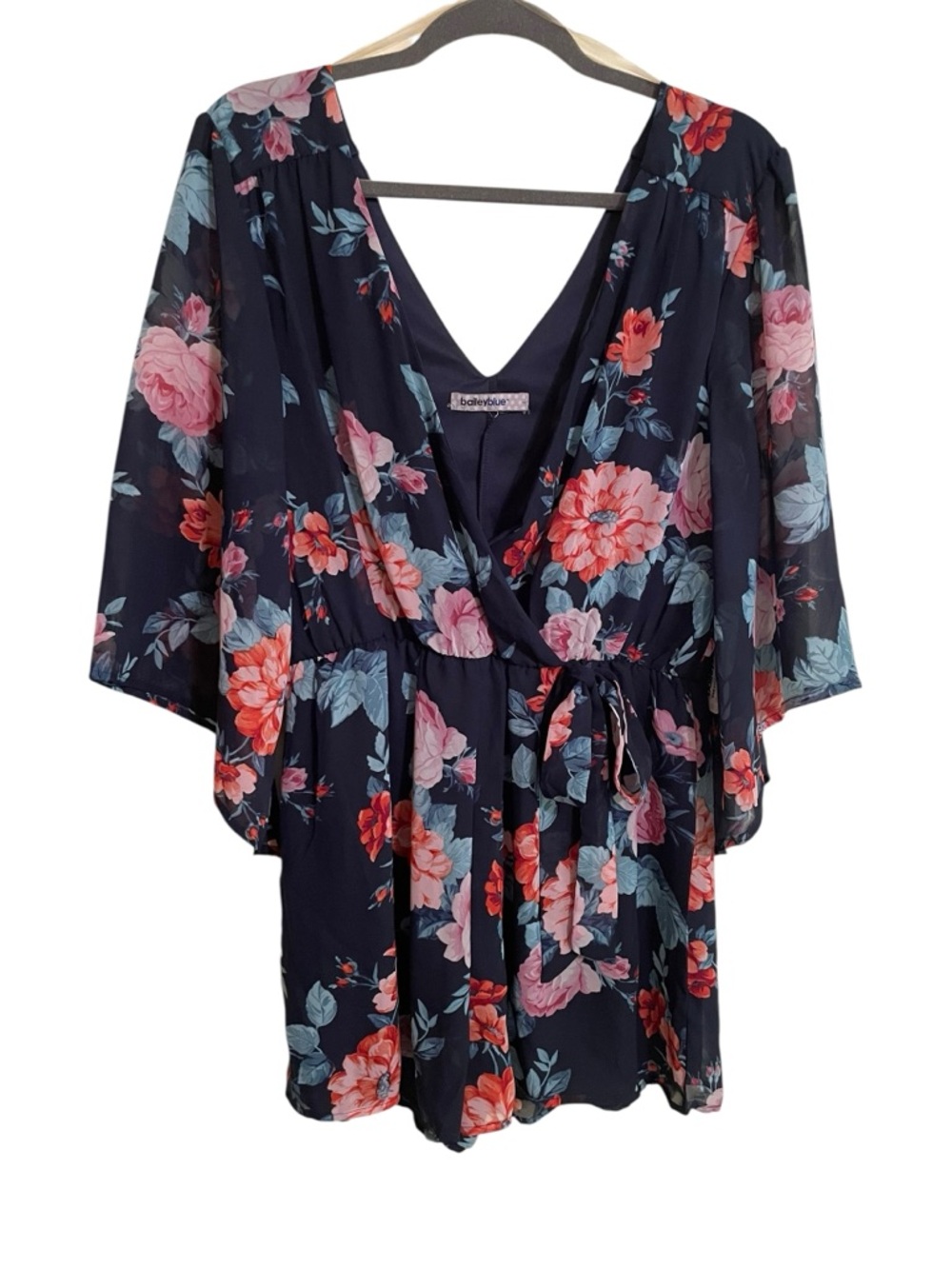 New navy blue floral romper. Size tag missing